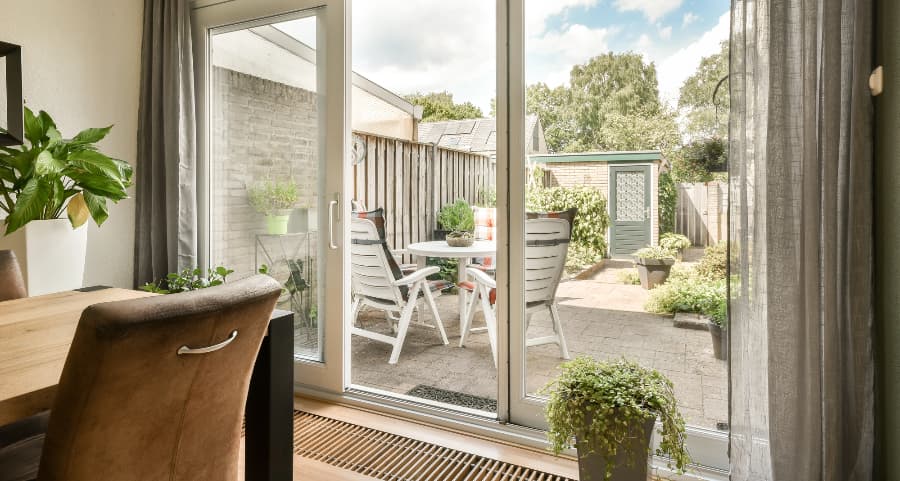 Sliding glass door connecting home to an outdoor living space